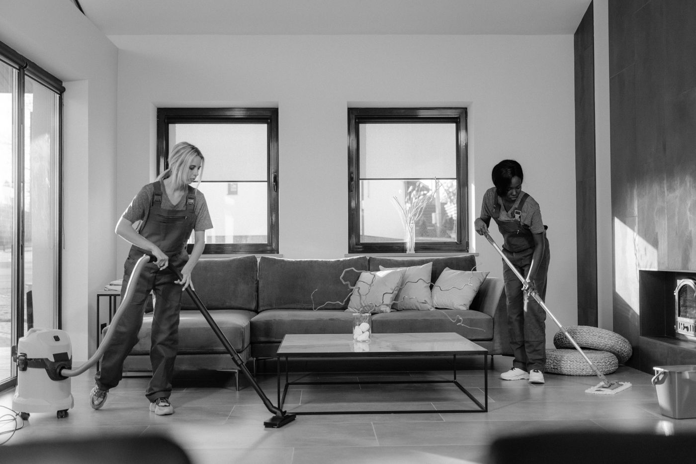 Professional team cleaning a living room